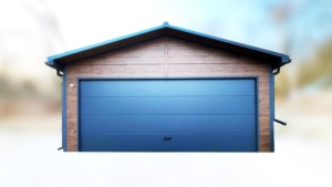 6×5,8m-es delux szigetelt mobilgarázs nyeregtetővel, sötét diófa falakkal, antracitszürke szekcionált kapuval és ajtóval, ablakkal, szellőzőráccsal, szegélyekkel, ereszcsatornával, antracitszürke cserepeslemez tetőborítással